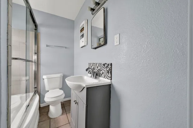 a bathroom with a sink toilet and vanity