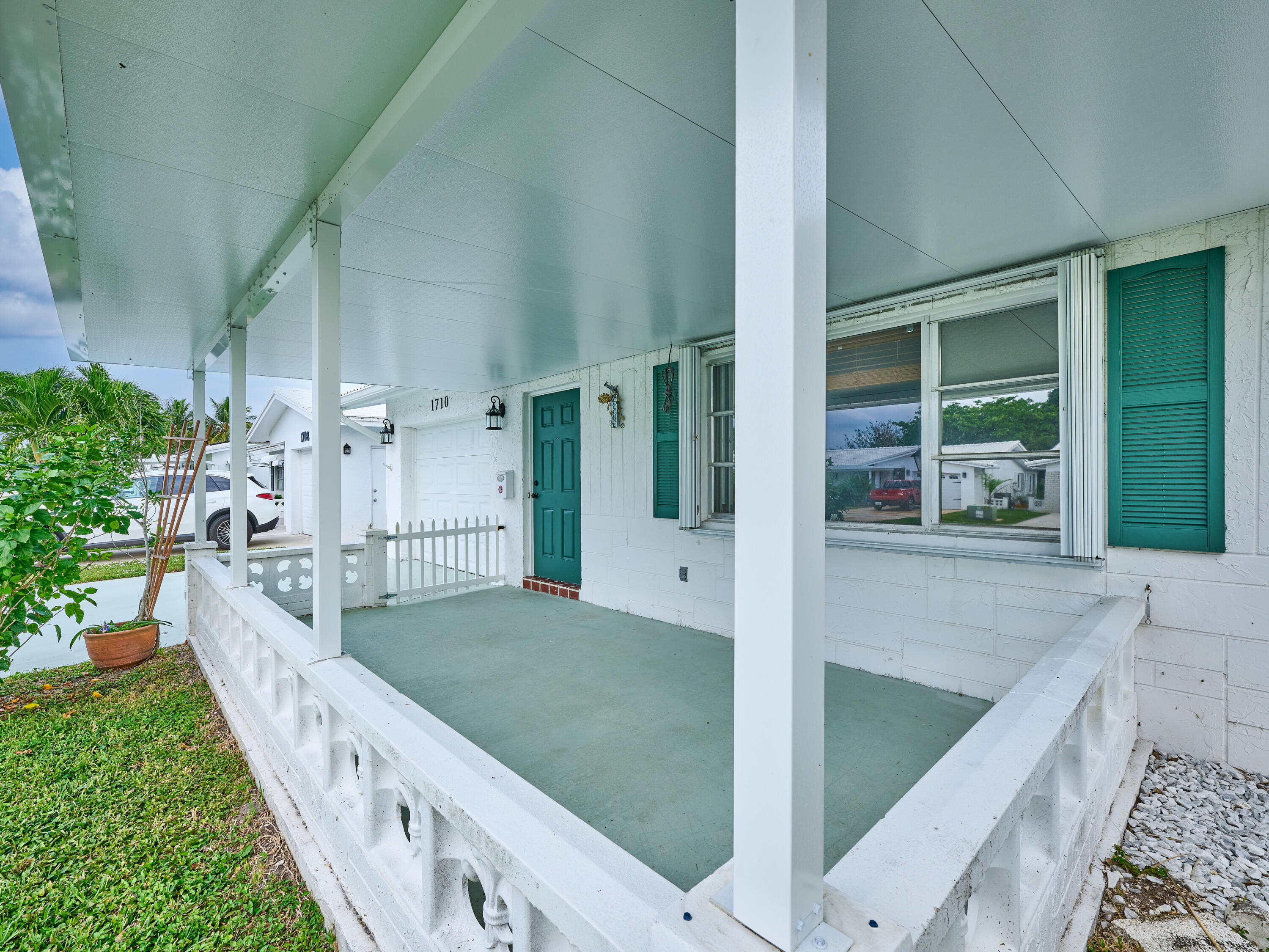 1710 Southwest 22nd Street Boynton Beach, FL 33426 - Photo 2 of 81 Covered Front porch