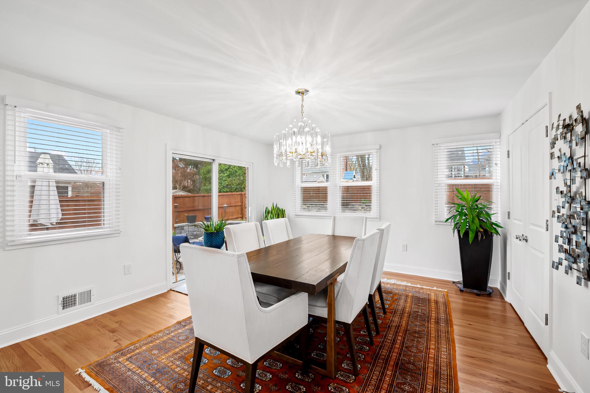 312 Waveland Road Catonsville, MD 21228 - Photo 16 of 40 a view of a dining room with furniture window and wooden floor