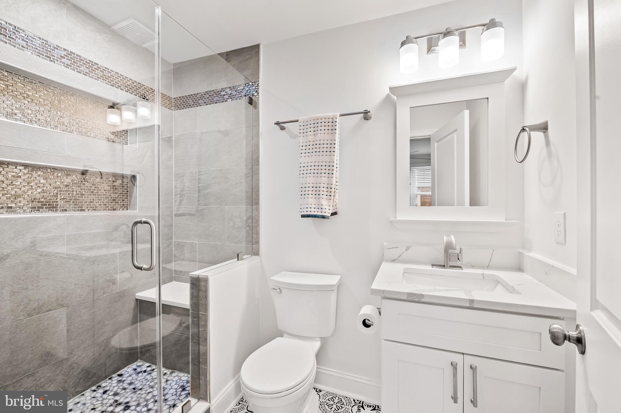 312 Waveland Road Catonsville, MD 21228 - Photo 21 of 40 a bathroom with a sink toilet and shower