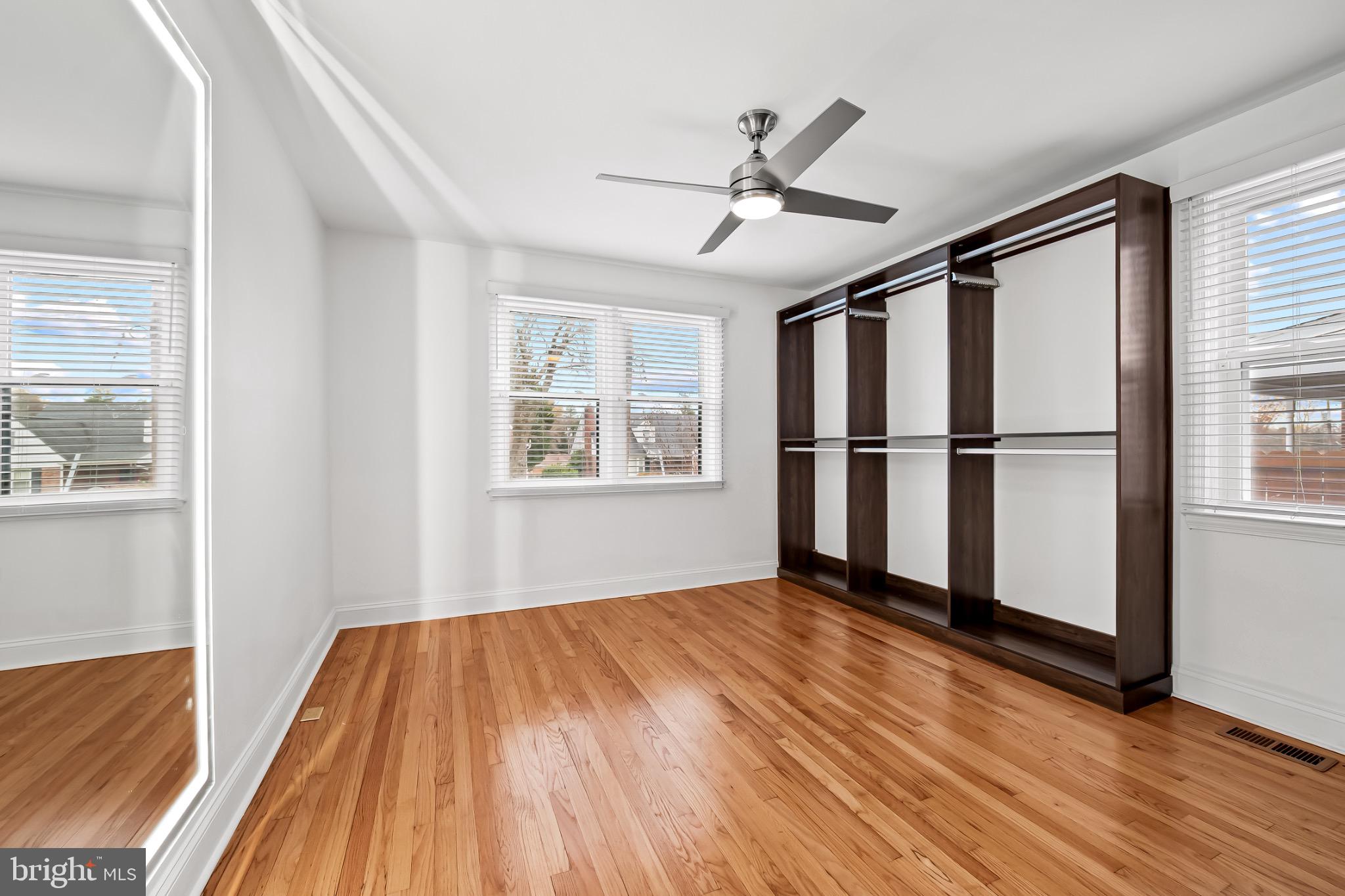 312 Waveland Road Catonsville, MD 21228 - Photo 22 of 40 a view of empty room with wooden floor and fan