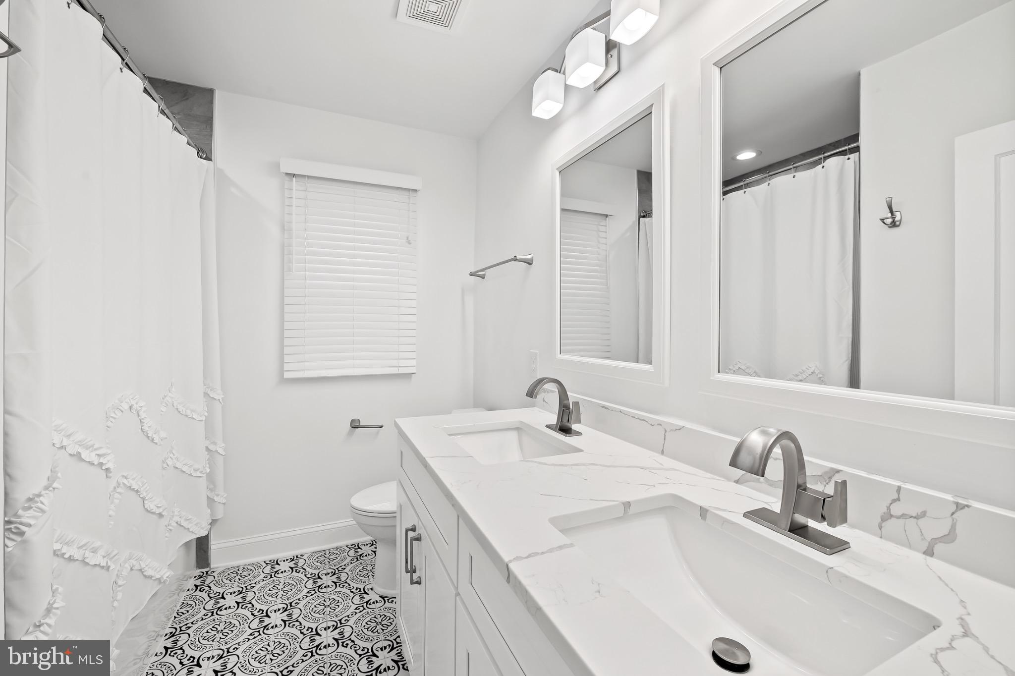 312 Waveland Road Catonsville, MD 21228 - Photo 24 of 40 a bathroom with a sink and a toilet