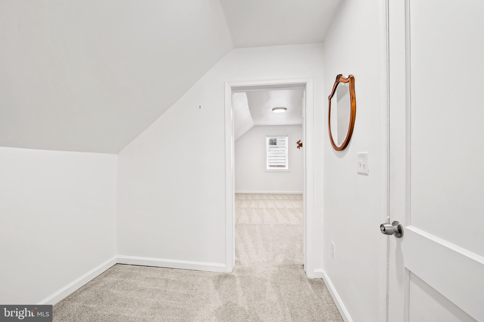 312 Waveland Road Catonsville, MD 21228 - Photo 25 of 40 a view of a room with wooden floor and white walls