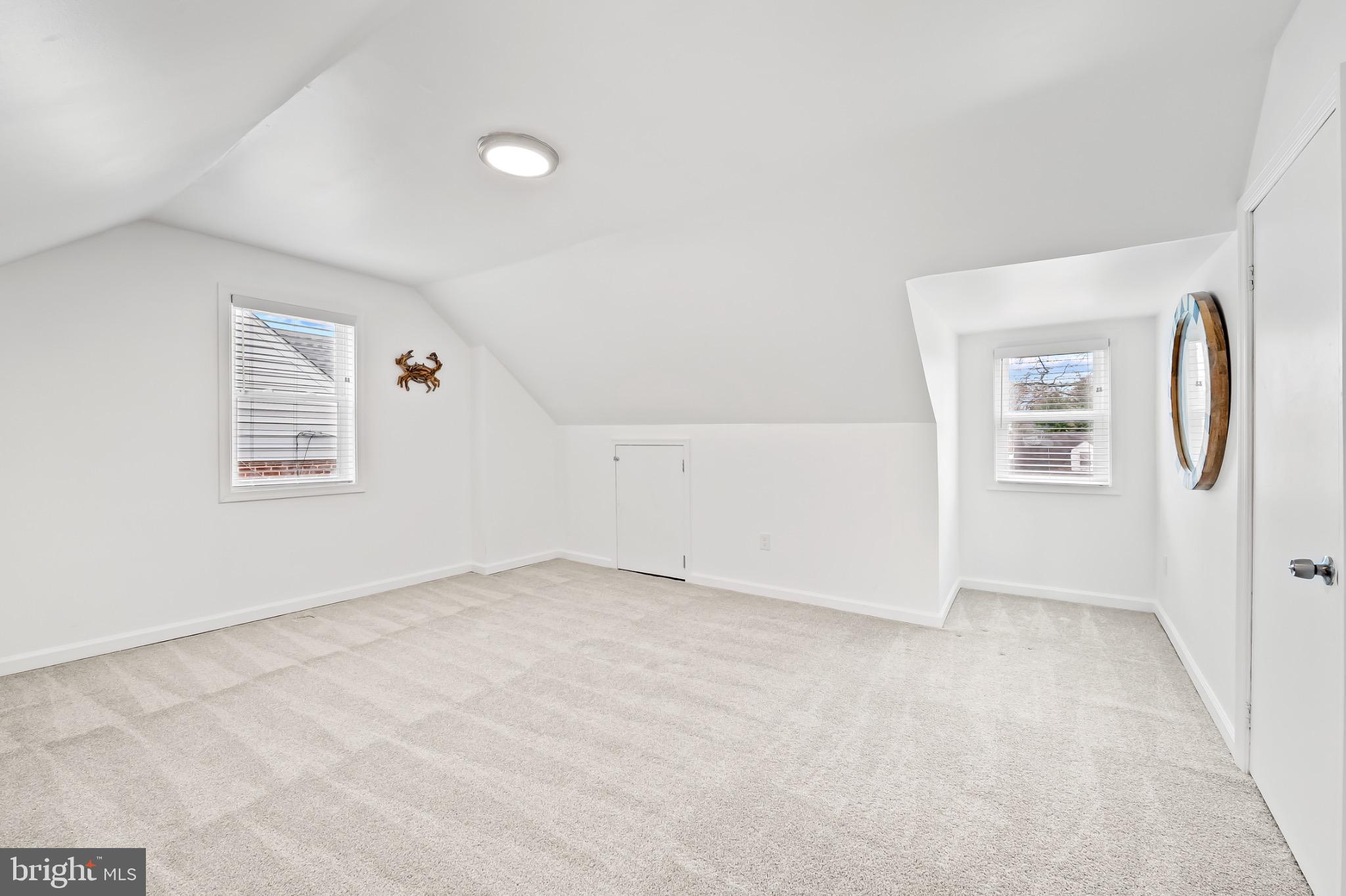 312 Waveland Road Catonsville, MD 21228 - Photo 28 of 40 an empty room with windows and painted walls