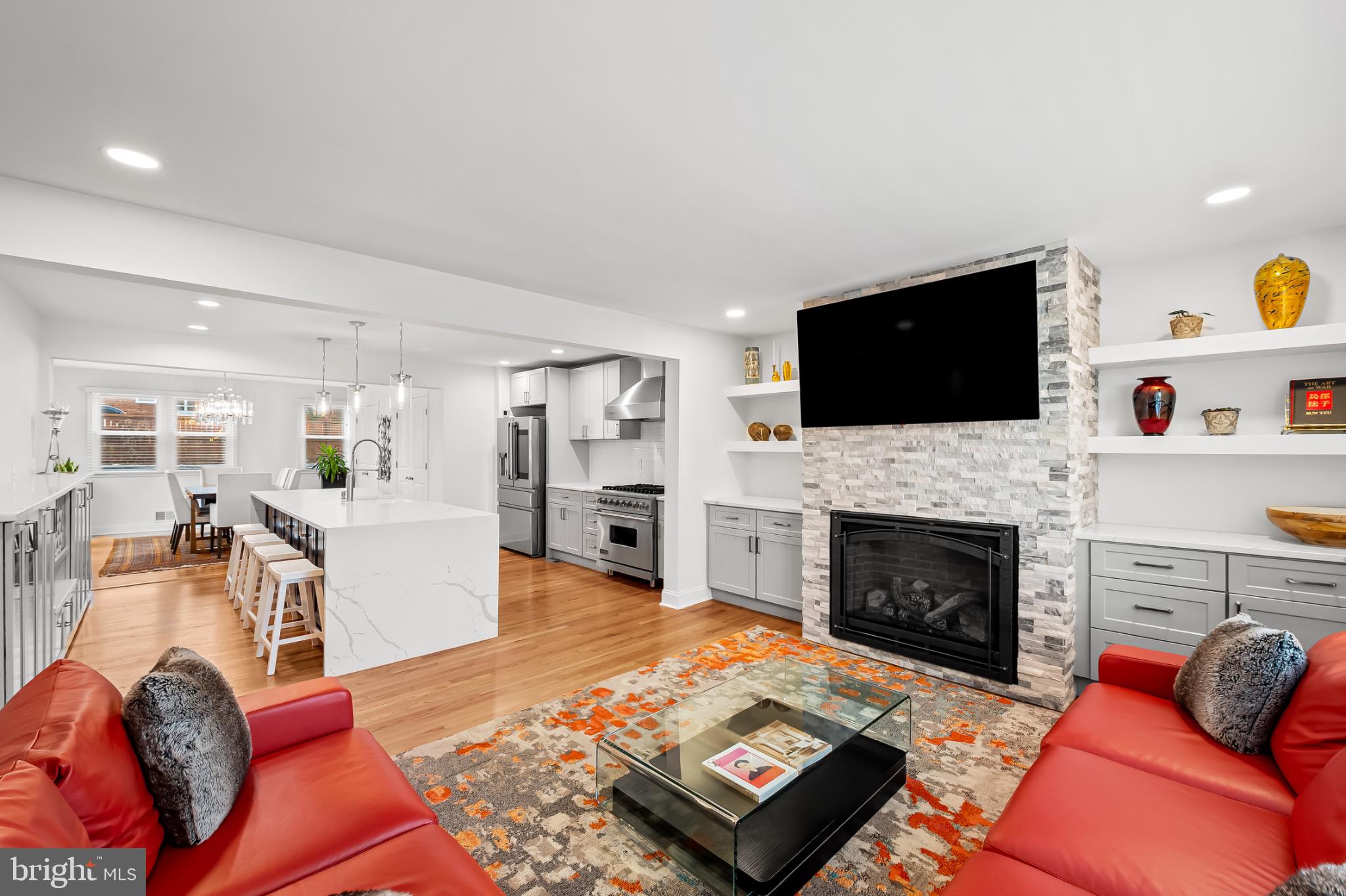 312 Waveland Road Catonsville, MD 21228 - Photo 7 of 40 a living room with furniture a flat screen tv and a fireplace