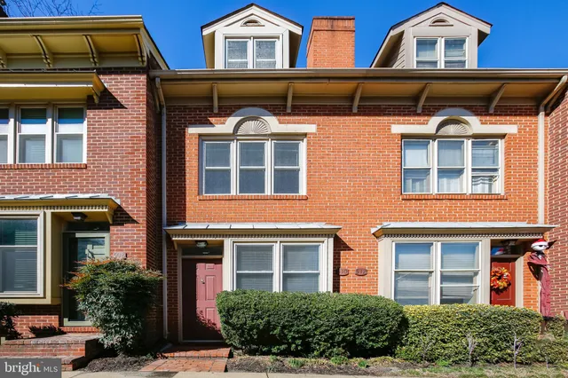 a front view of residential houses with street