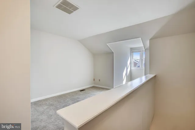 an empty room with mirror