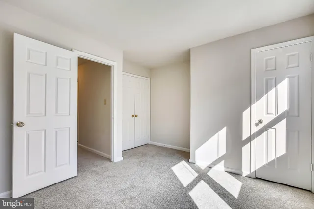 a view of an empty room and a window