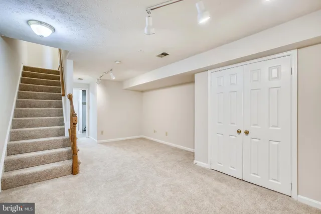 an empty room with white walls