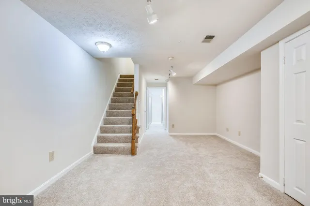 an empty room with a staircase