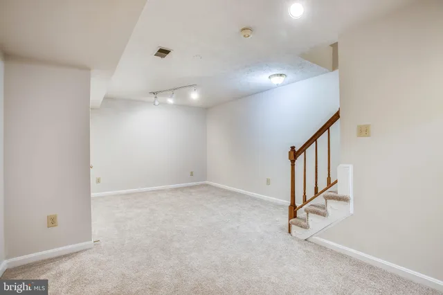 an entryway in a hall with a window