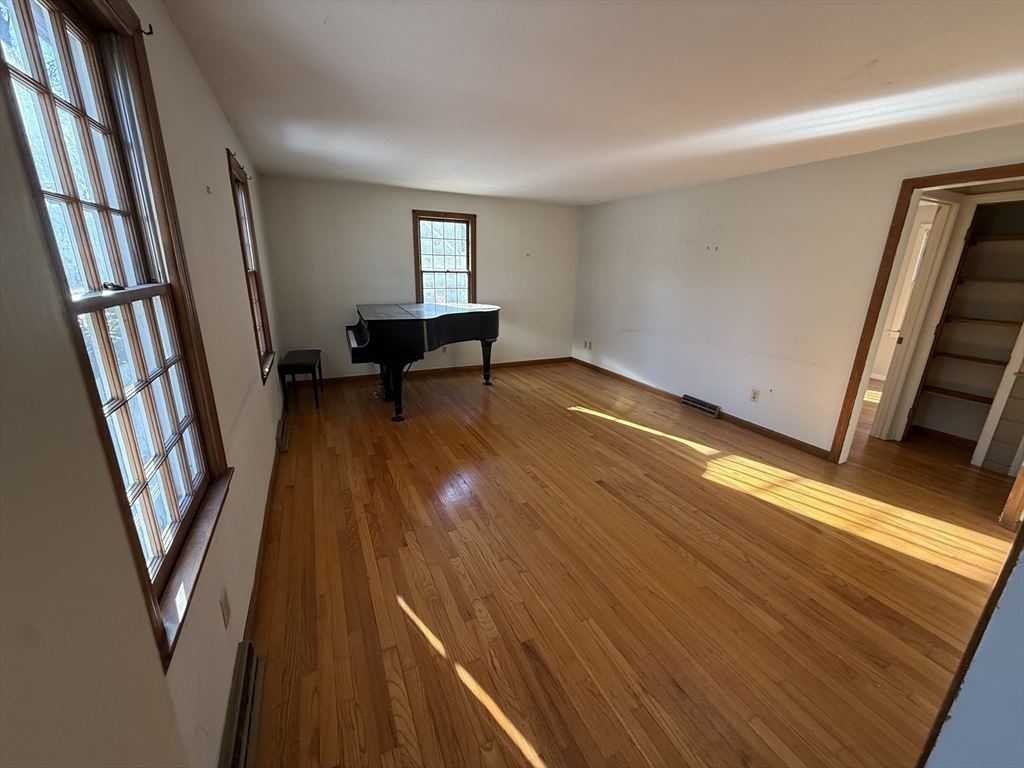 54 Rogers Road East Longmeadow, MA 01028 - Photo 13 of 21 a view of an empty room with wooden floor and stairs
