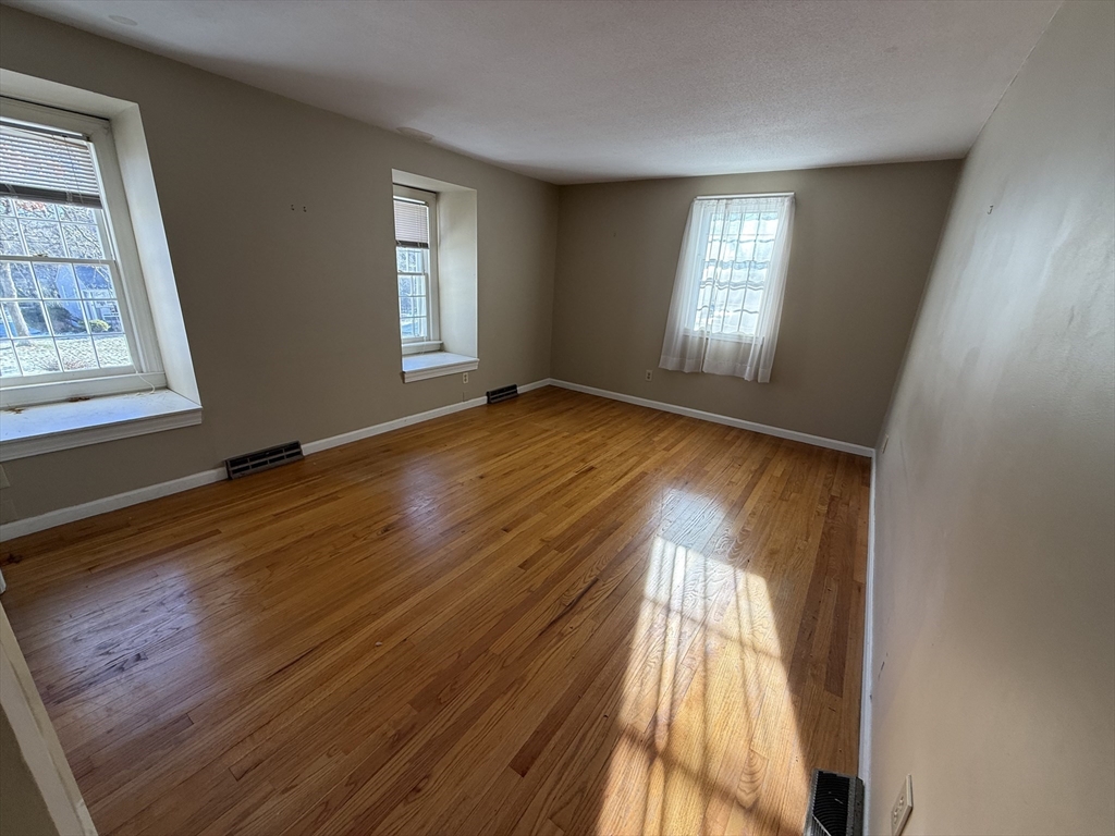 54 Rogers Road East Longmeadow, MA 01028 - Photo 16 of 21 an empty room with wooden floor and windows