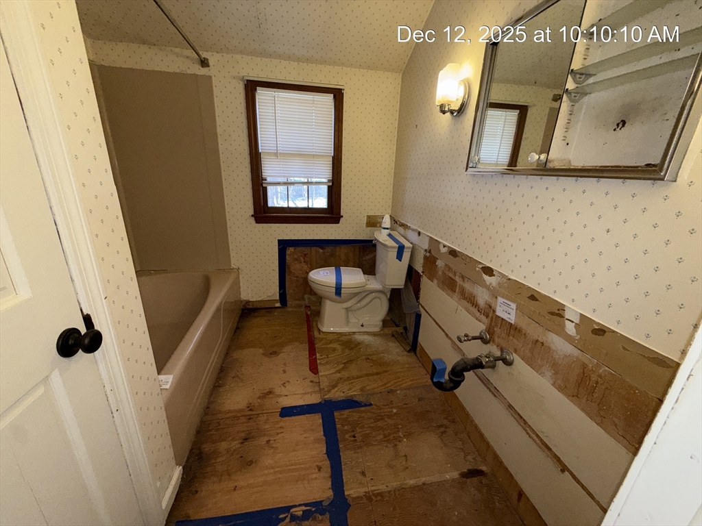 54 Rogers Road East Longmeadow, MA 01028 - Photo 17 of 21 a bathroom with a sink and mirror with bathtub