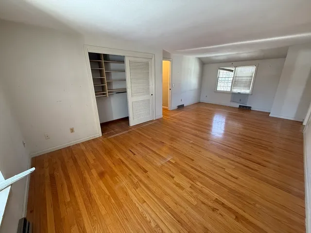 a view of an empty room with stairs