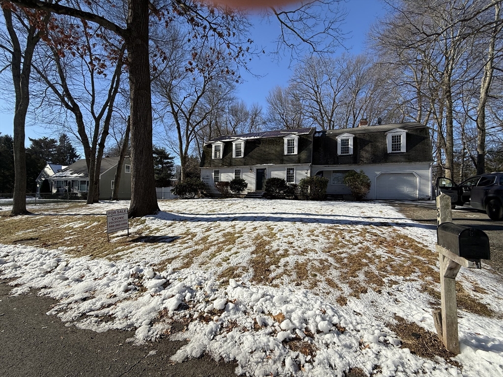54 Rogers Road East Longmeadow, MA 01028 - Photo 2 of 21 a front view of a house with a yard covered with snow