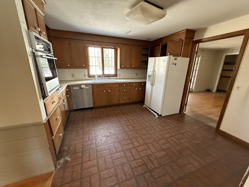 54 Rogers Road East Longmeadow, MA 01028 - Photo 9 of 21 a kitchen with a refrigerator and a stove