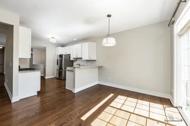 a view of a kitchen with electric appliances