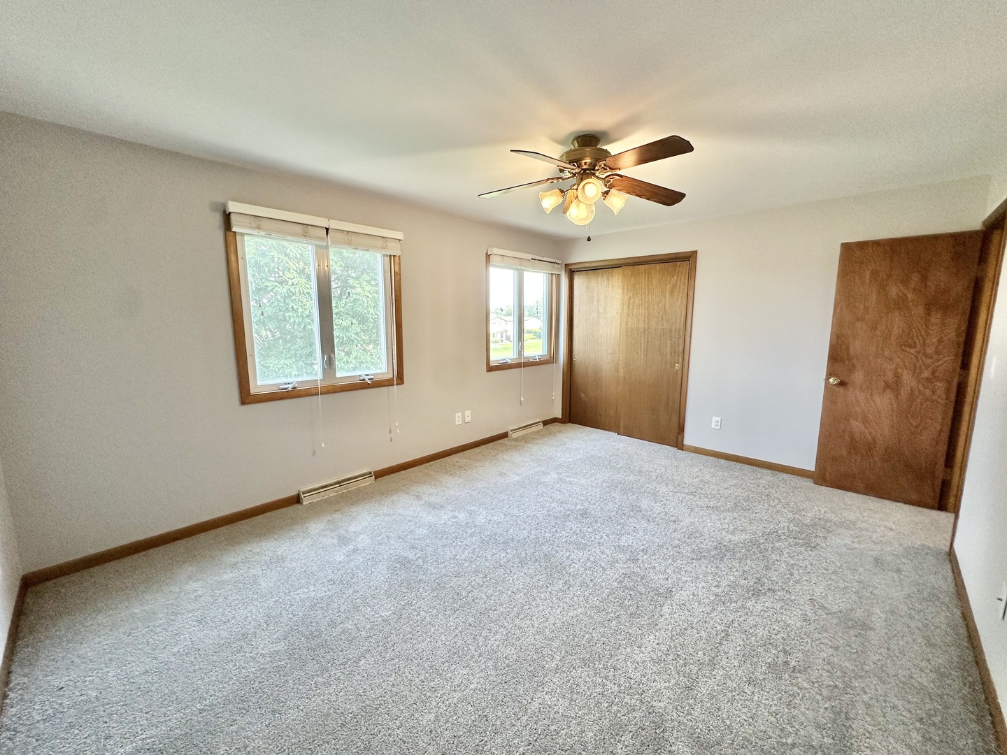 762 Lake Road New Lenox, IL 60451 - Photo 16 of 24 an empty room with windows and fan
