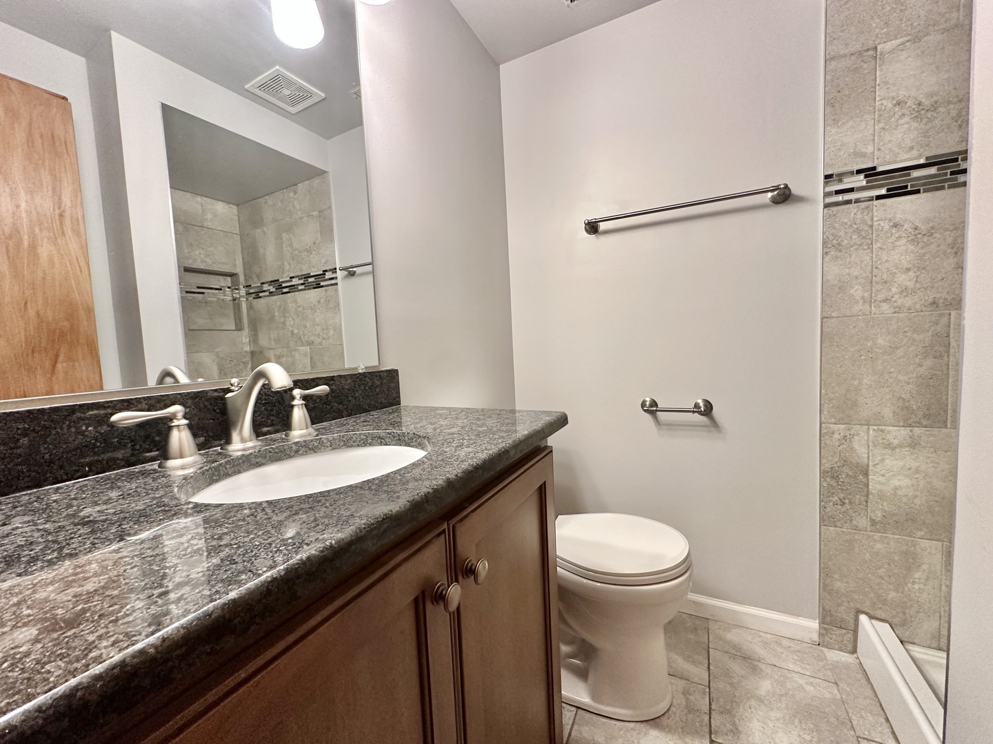 762 Lake Road New Lenox, IL 60451 - Photo 20 of 24 a bathroom with a granite countertop sink mirror vanity and toilet