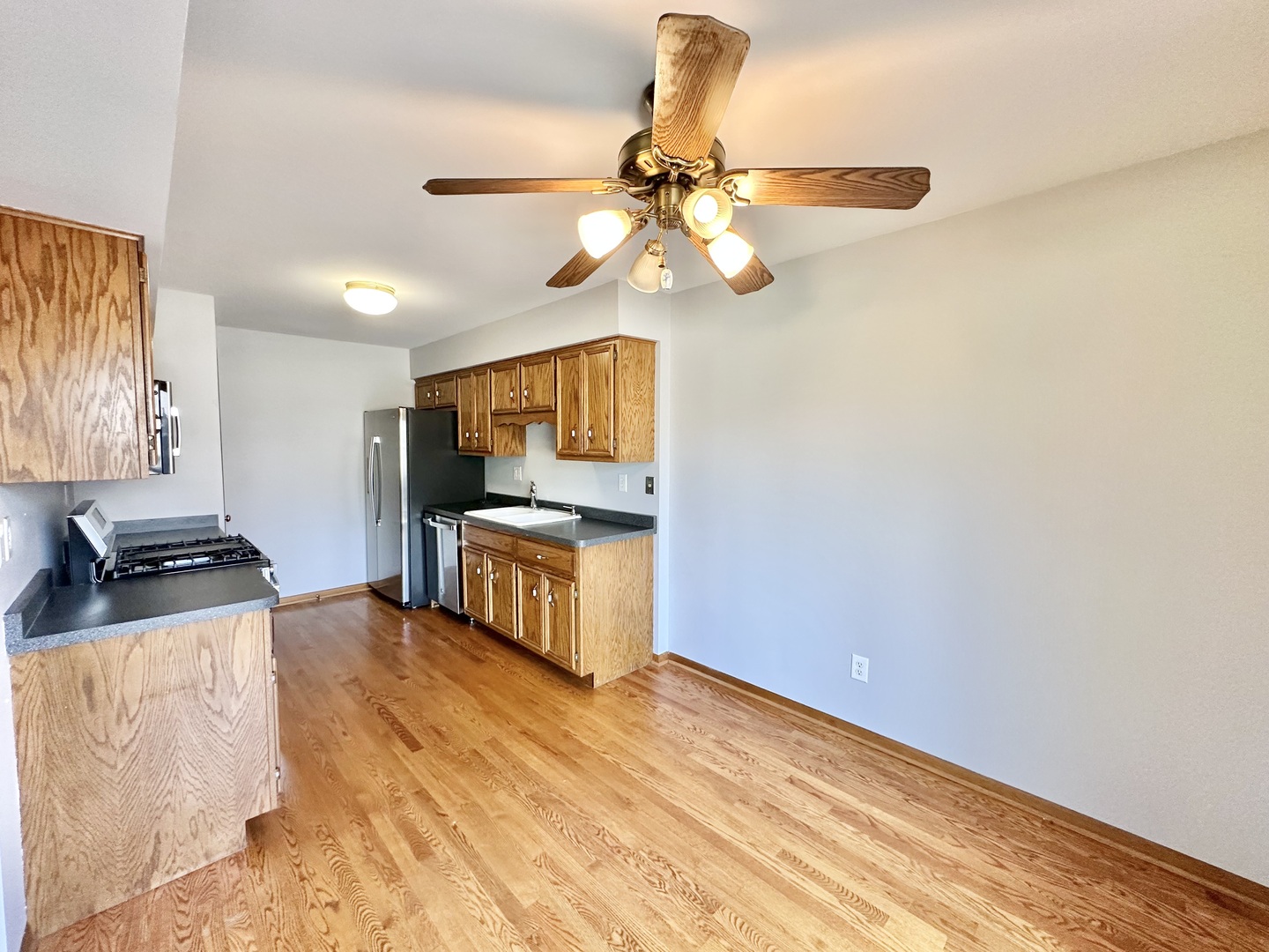 762 Lake Road New Lenox, IL 60451 - Photo 7 of 24 a kitchen with stainless steel appliances a stove a refrigerator sink and cabinets