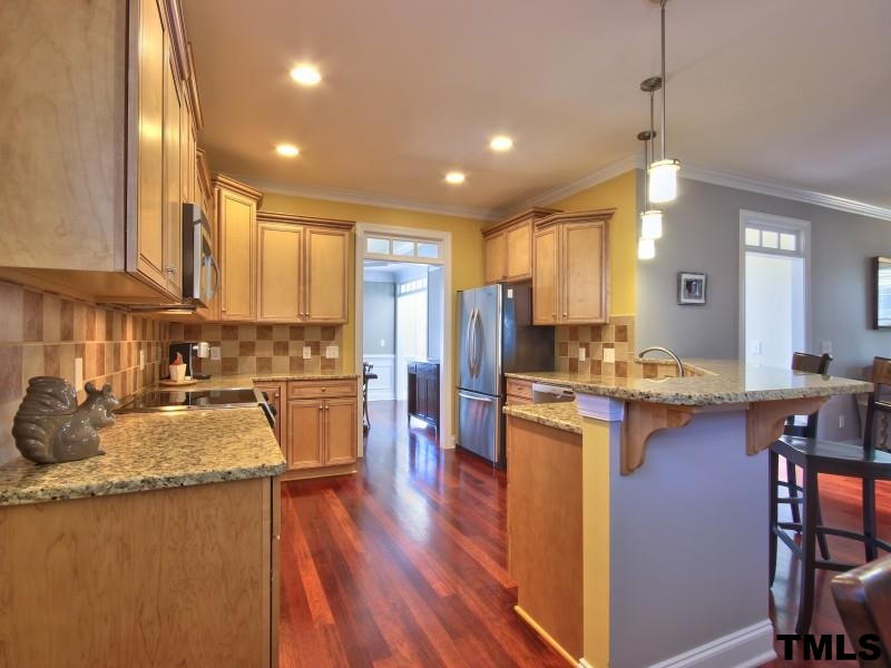2113 Karns Place Raleigh, NC 27614 - Photo 8 of 24 a kitchen with lots of counter top space and stainless steel appliances