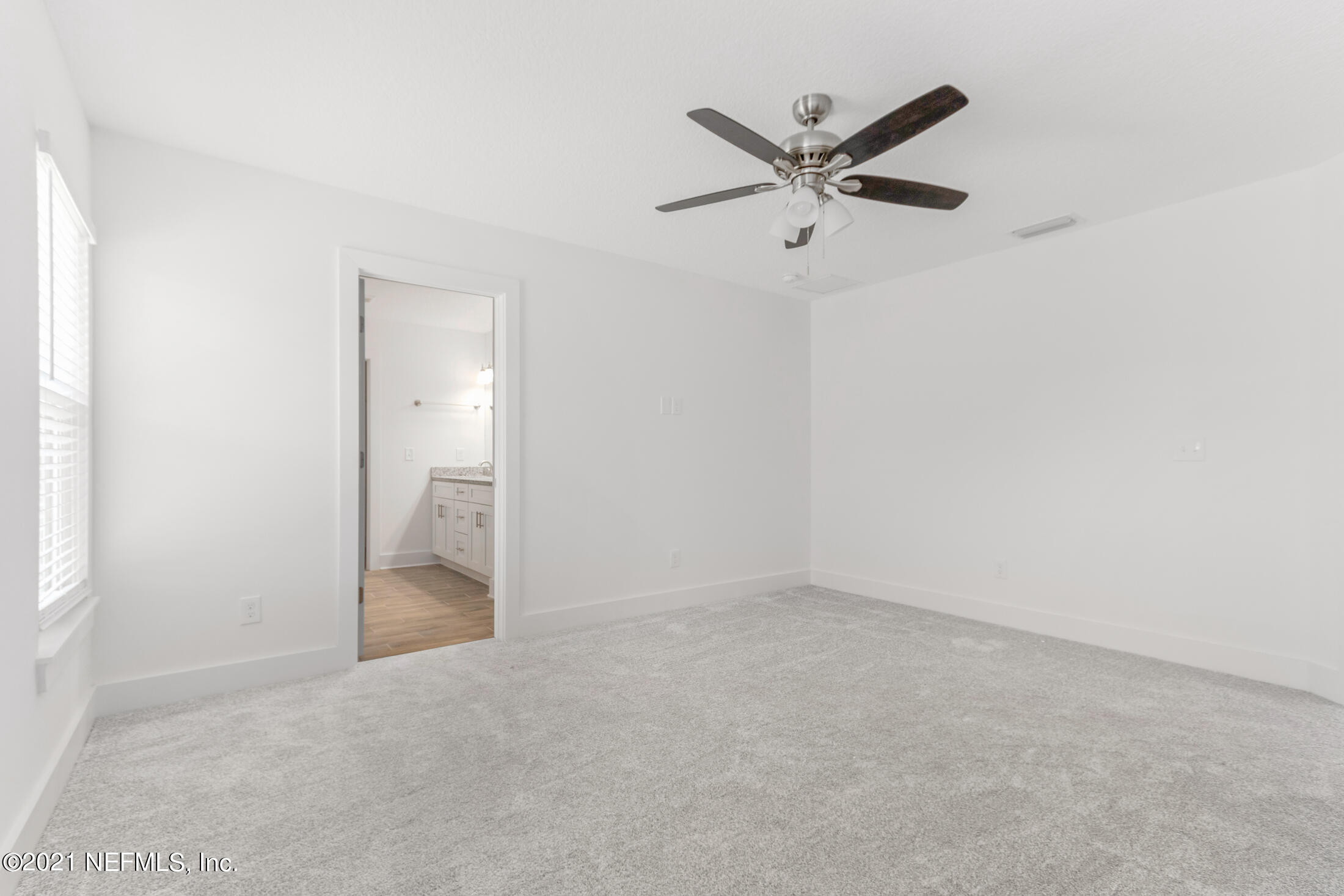 528 Meteor Street Jacksonville, FL 32205 - Photo 14 of 34 an empty room with closet and windows