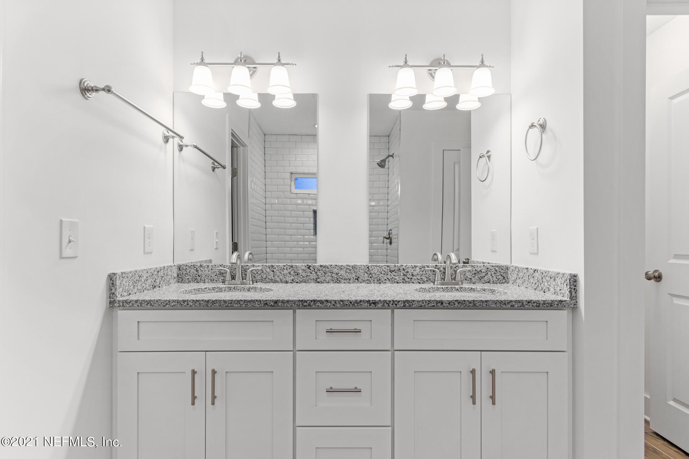 528 Meteor Street Jacksonville, FL 32205 - Photo 16 of 34 a bathroom with a sink vanity and a mirror
