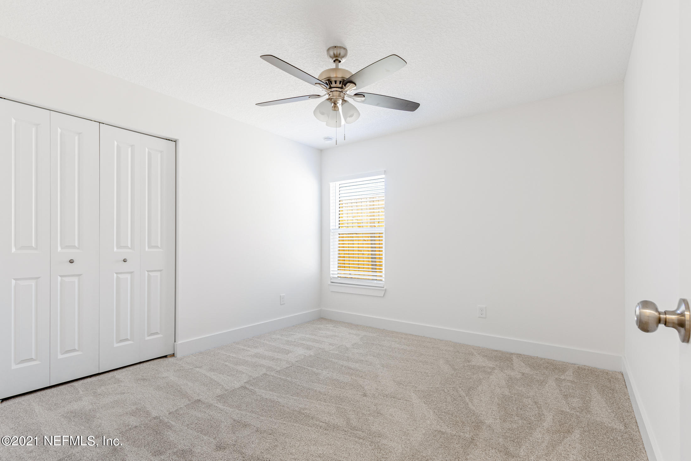 528 Meteor Street Jacksonville, FL 32205 - Photo 23 of 34 an empty room with a window and a fan