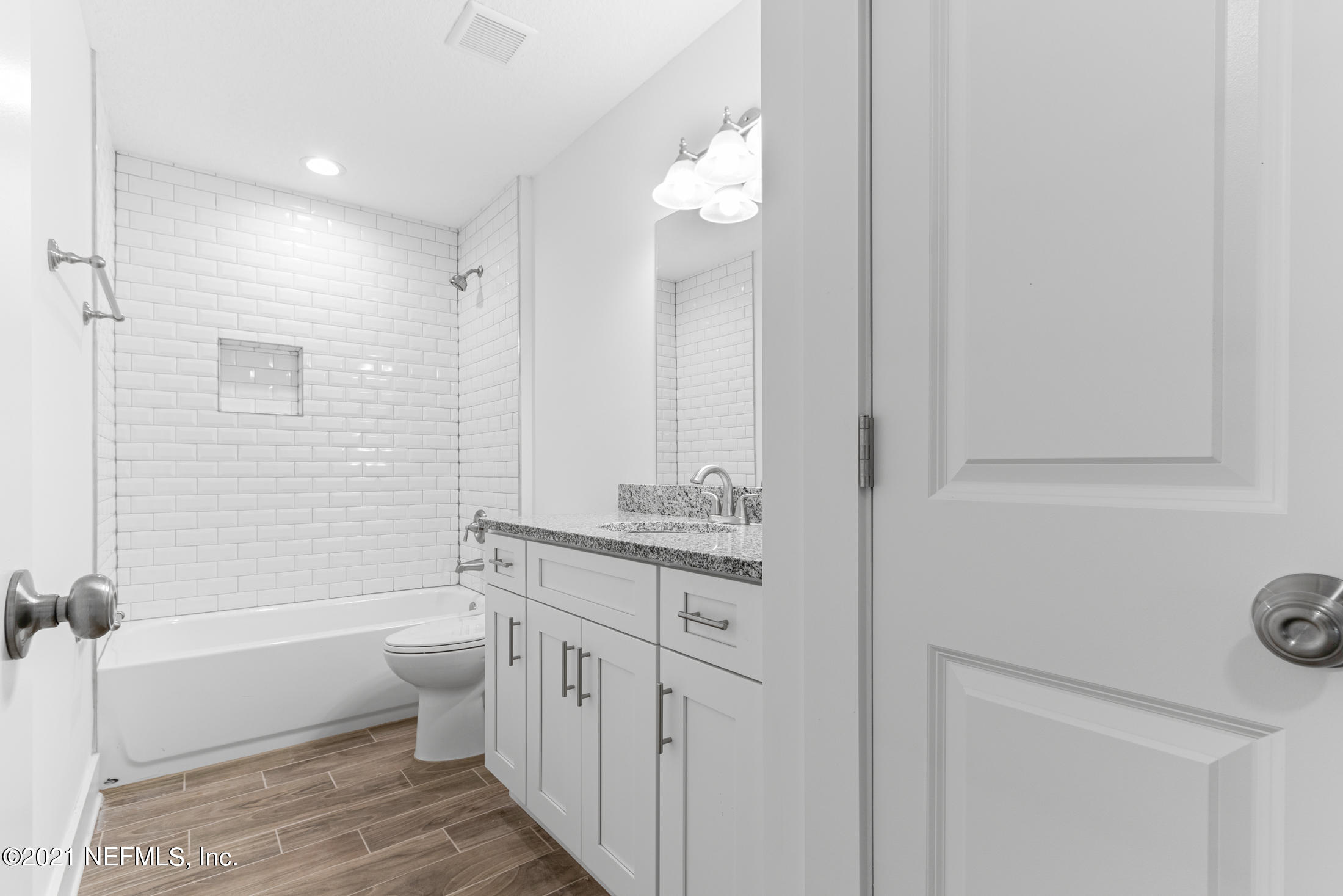 528 Meteor Street Jacksonville, FL 32205 - Photo 25 of 34 a bathroom with a granite countertop sink a toilet and bathtub