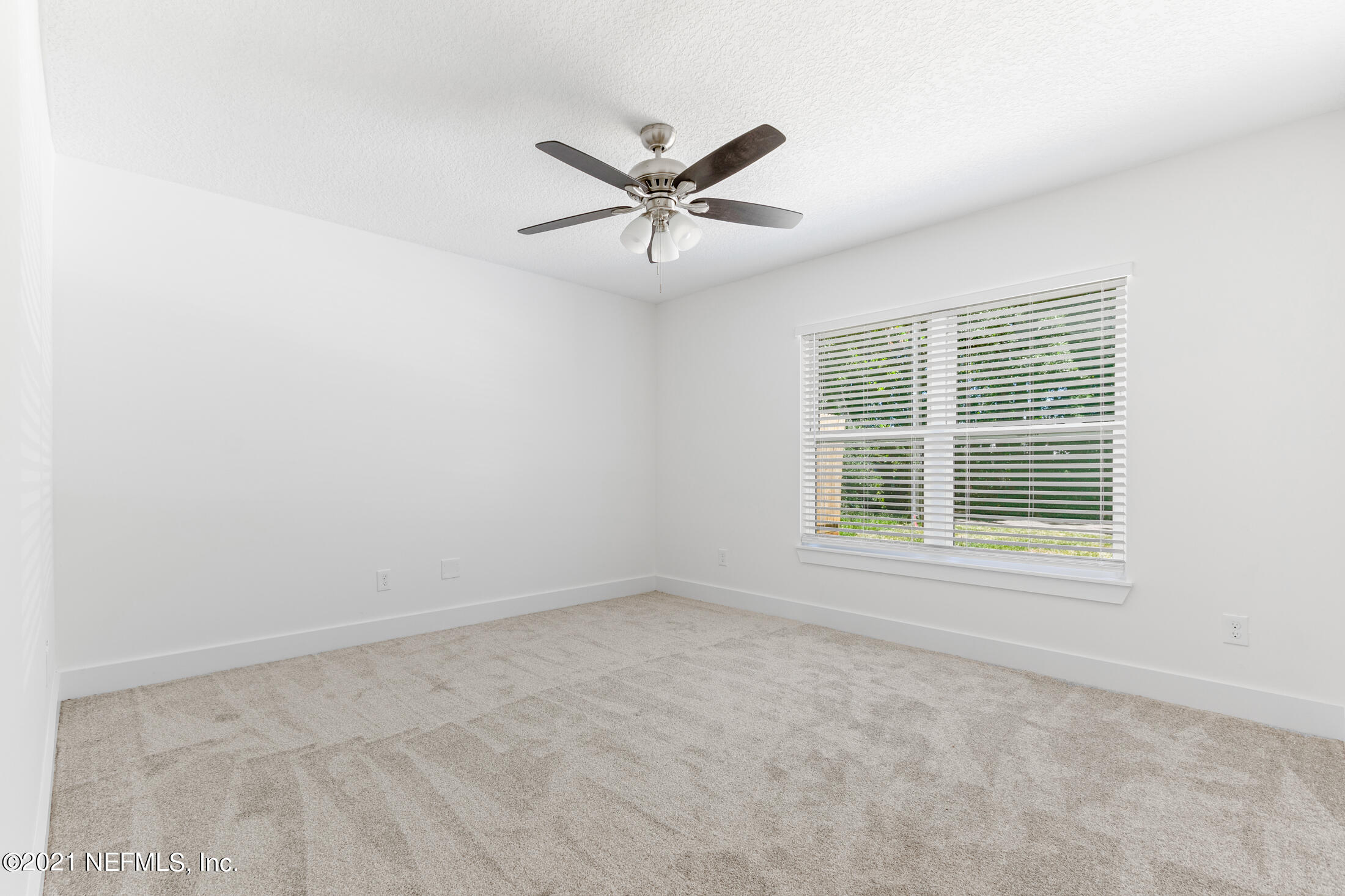 528 Meteor Street Jacksonville, FL 32205 - Photo 26 of 34 a view of a livingroom with a ceiling fan and window