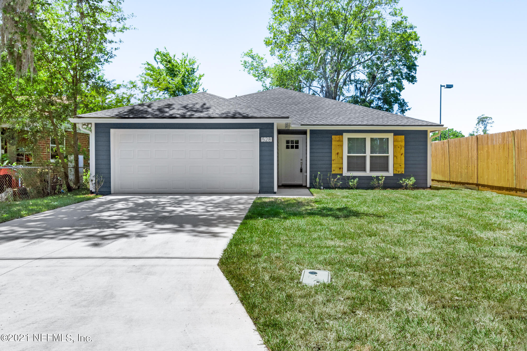 528 Meteor Street Jacksonville, FL 32205 - Photo 2 of 34 a front view of a house with a garden and yard