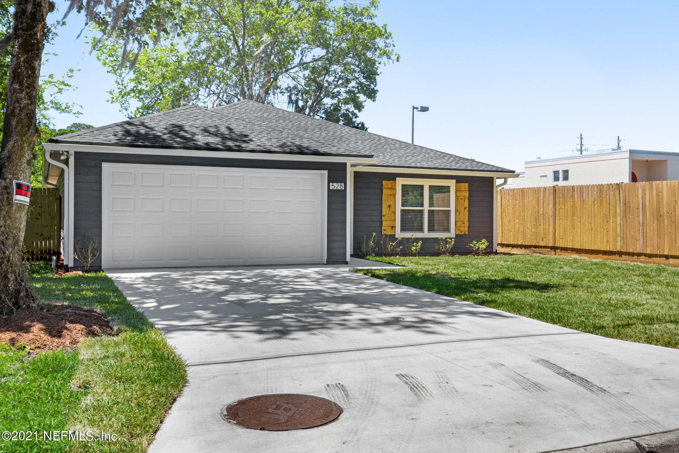 528 Meteor Street Jacksonville, FL 32205 - Photo 4 of 34 a view of a house with a yard and garage