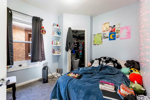 a bedroom with furniture and a window