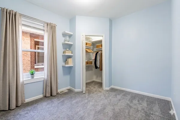 a view of an empty room and a window