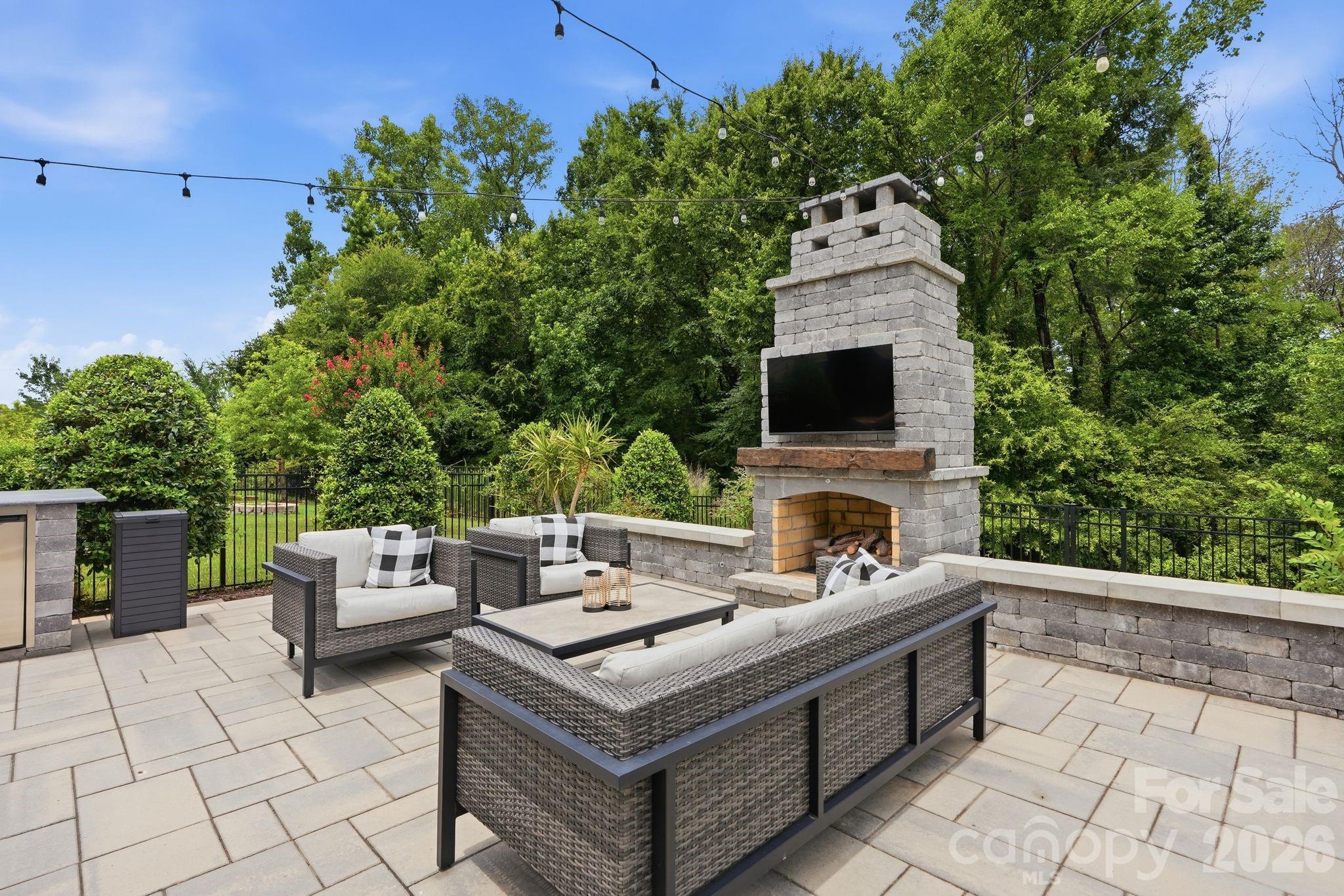 1086 Weir Court Fort Mill, SC 29708 - Photo 33 of 40 a view of a patio with furniture and a fireplace