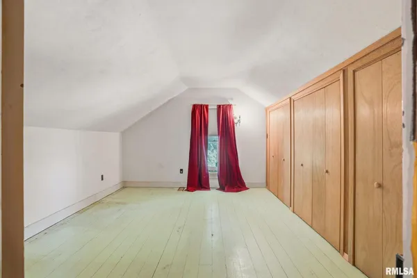 a view of a livingroom with an empty space and a window