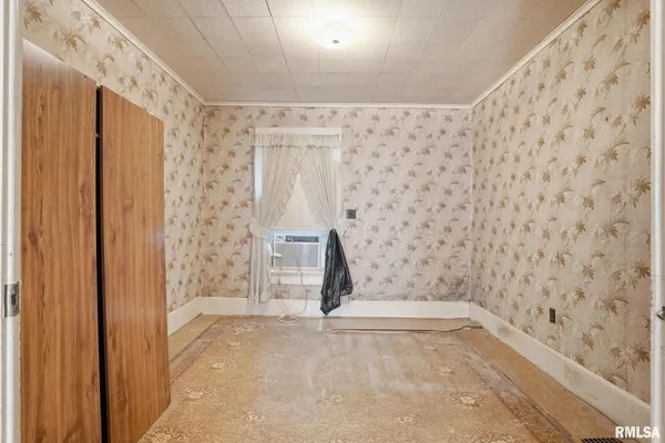 a kitchen with a stove a sink and a refrigerator