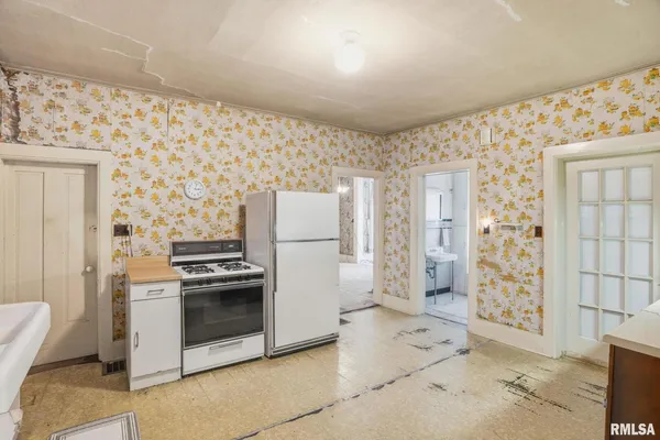 a bathroom with a sink a mirror and a shower