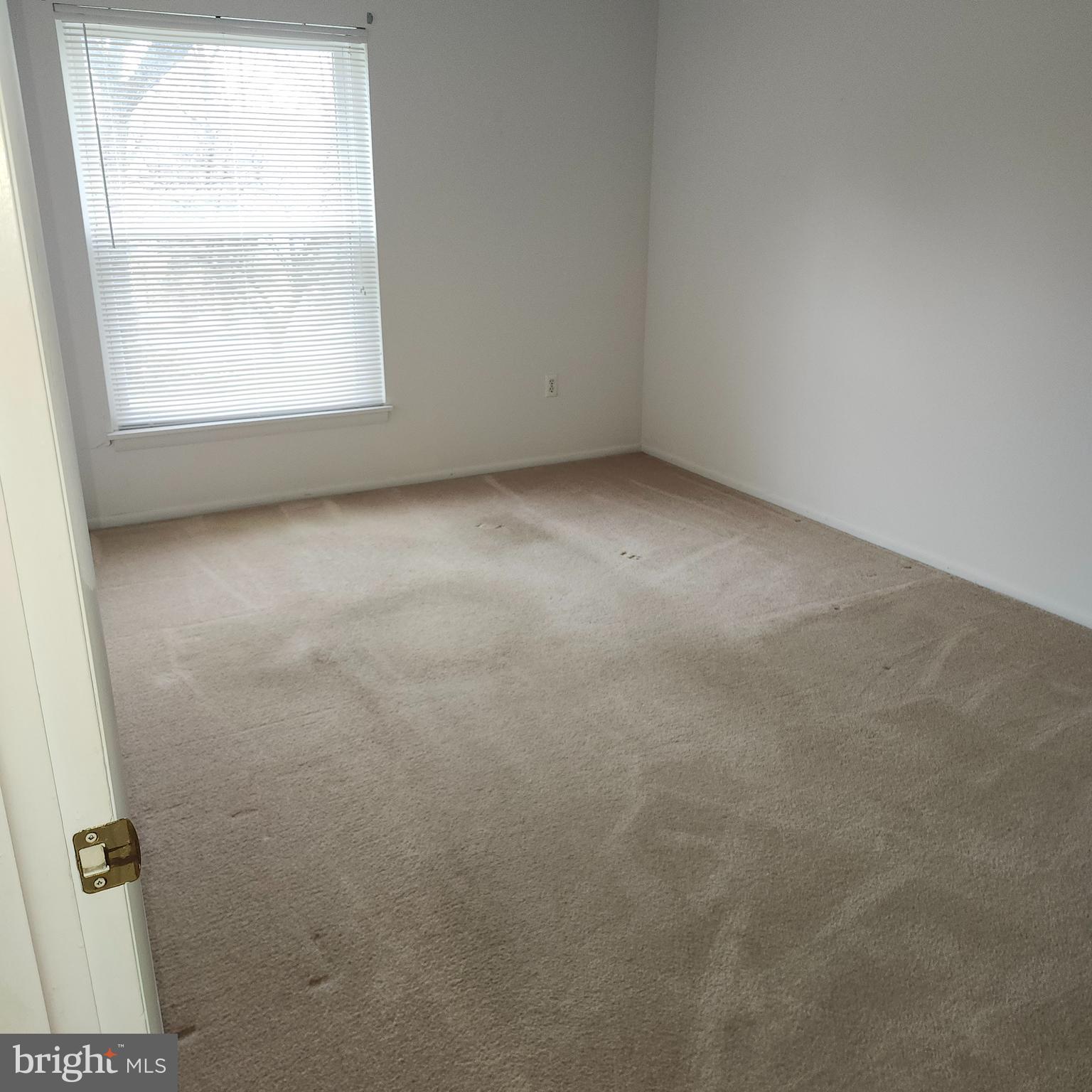 1375 Pershing Boulevard, Unit D4 Shillington, PA 19607 - Photo 3 of 5 an empty room with a window