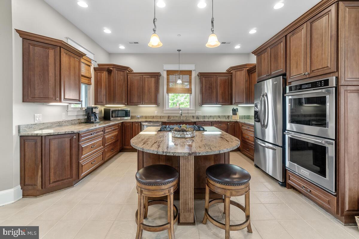 13380 Jesse Smith Road Mount Airy, MD 21771 - Photo 11 of 54 Relax around the kitchen island.