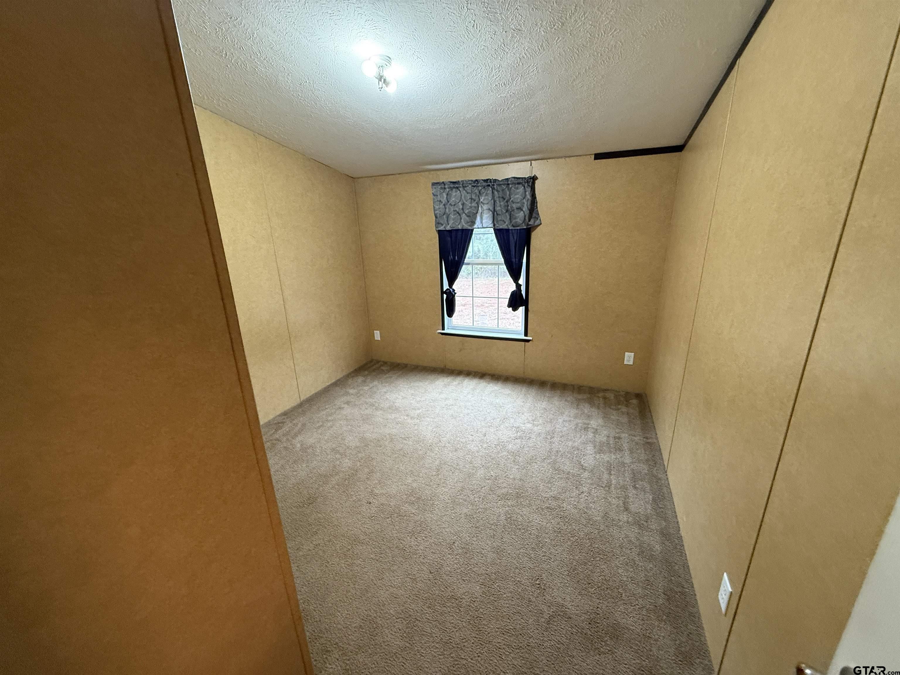 241 CR 2445 Rusk, TX 75785 - Photo 6 of 11 a view of a hallway with a small space