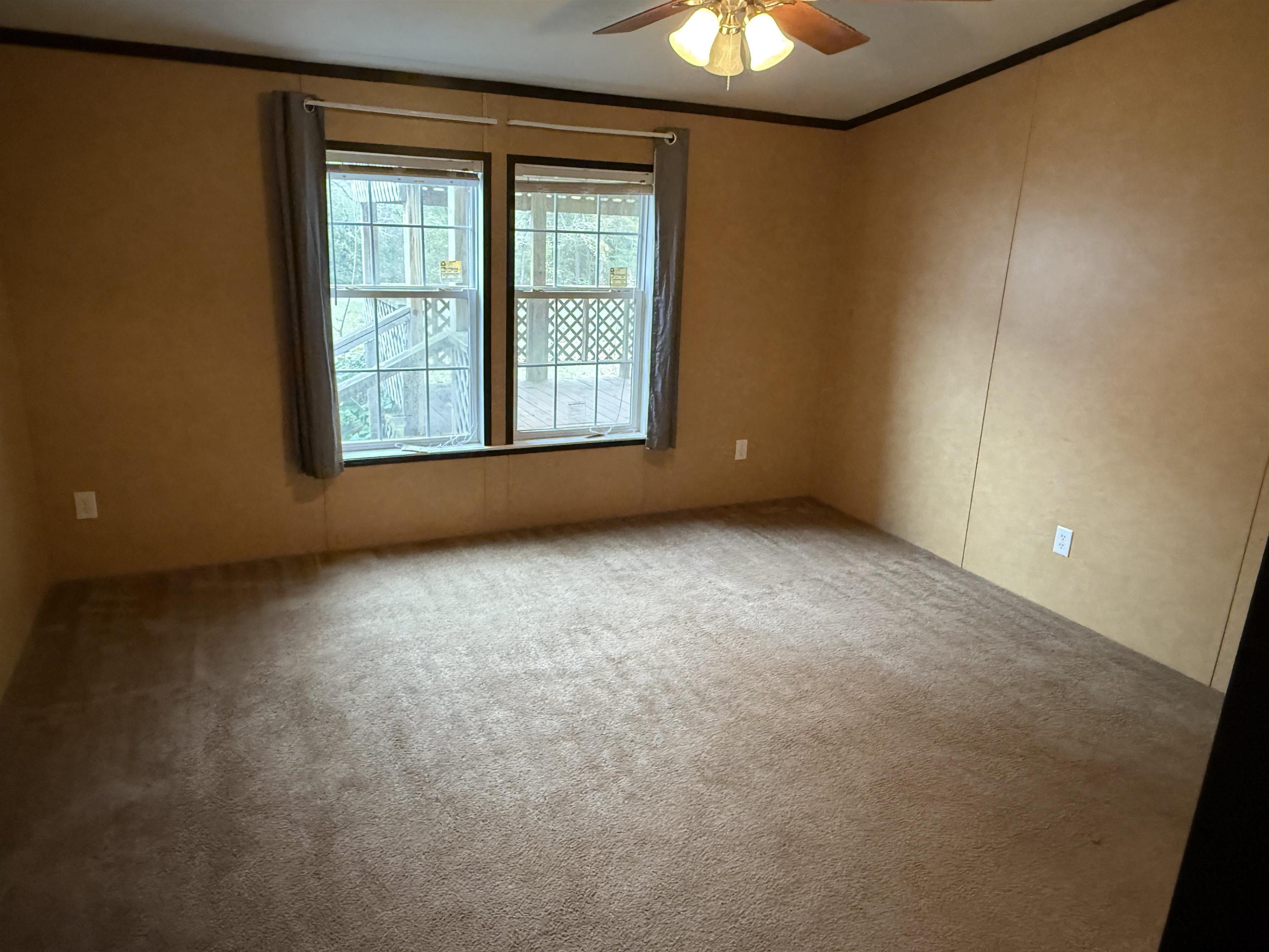 241 CR 2445 Rusk, TX 75785 - Photo 7 of 11 an empty room with windows