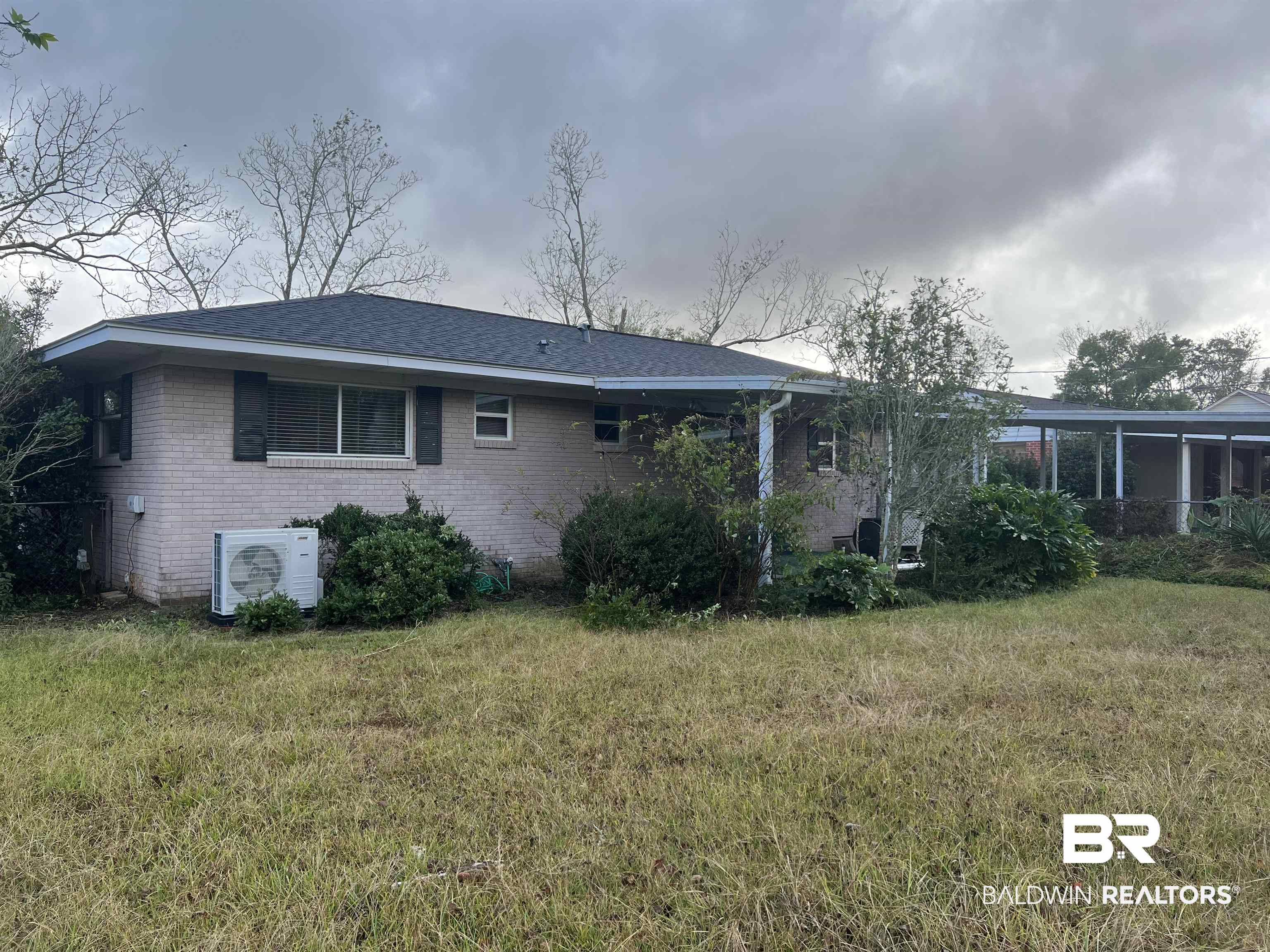 625 East Myrtle Avenue Foley, AL 36535 - Photo 10 of 10 Rear view of house featuring a yard