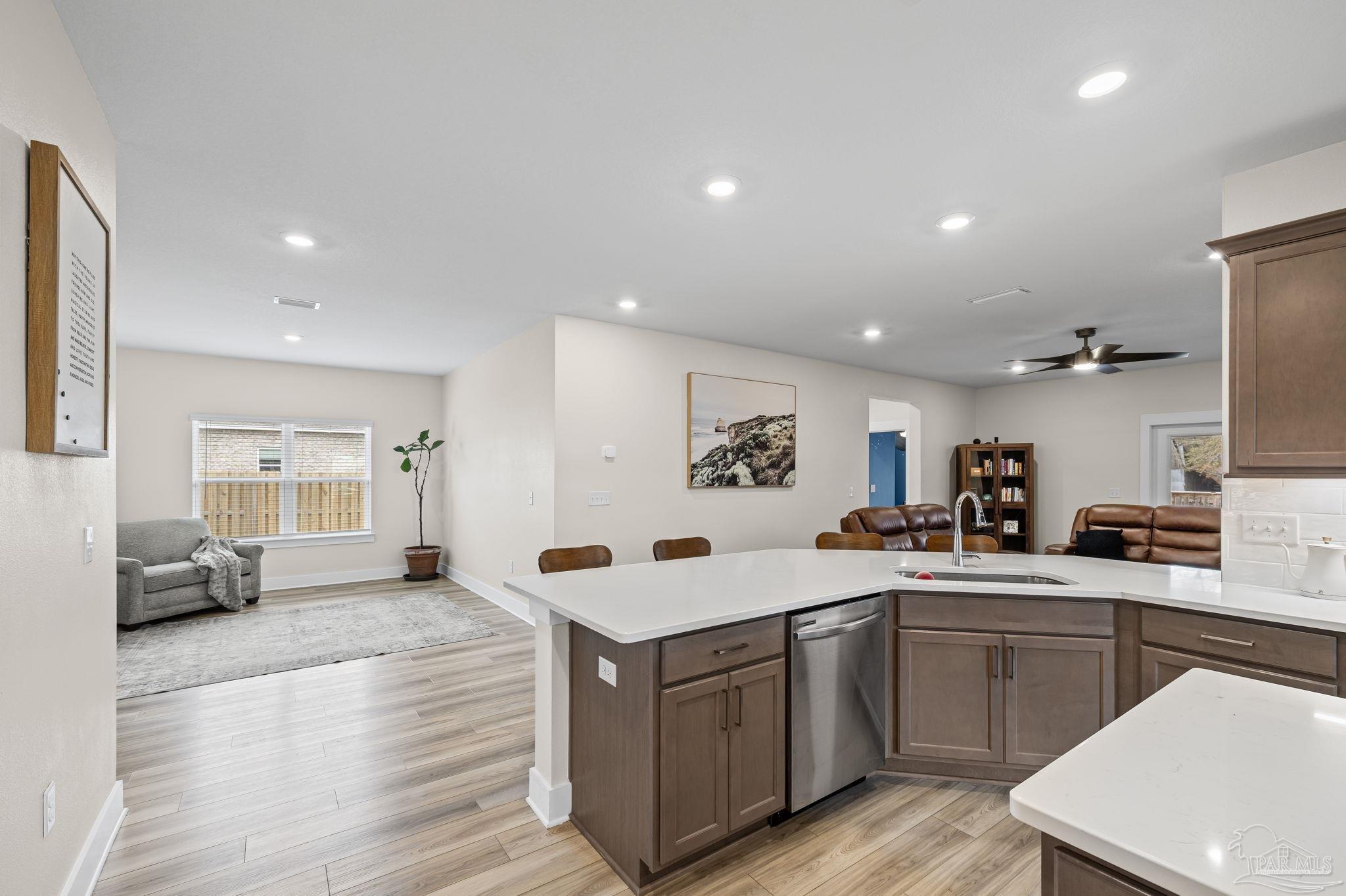6266 Dry Creek Road Molino, FL 32577 - Photo 13 of 68 a large white kitchen with stainless steel appliances