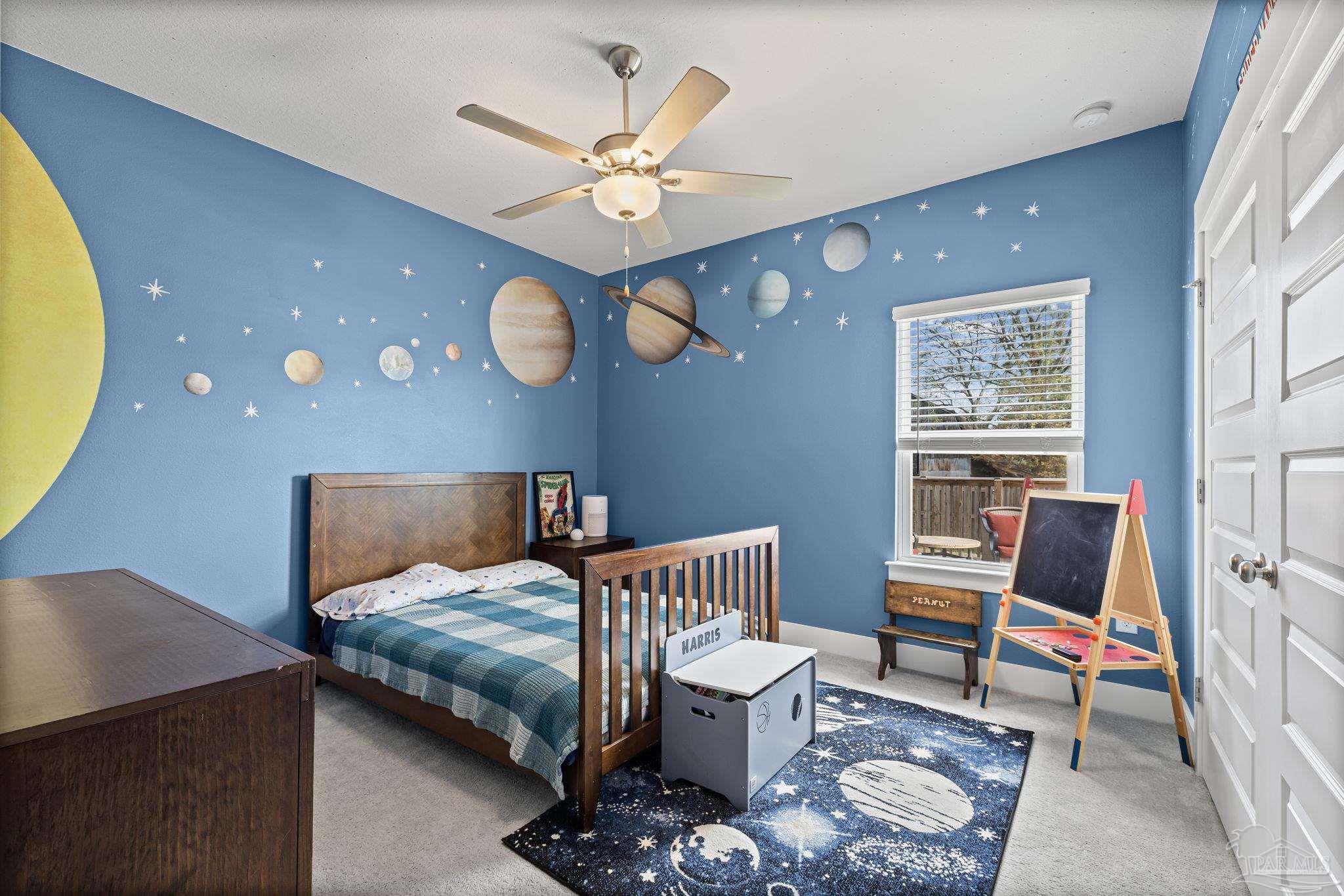 6266 Dry Creek Road Molino, FL 32577 - Photo 30 of 68 a bedroom with a bed and a chandelier