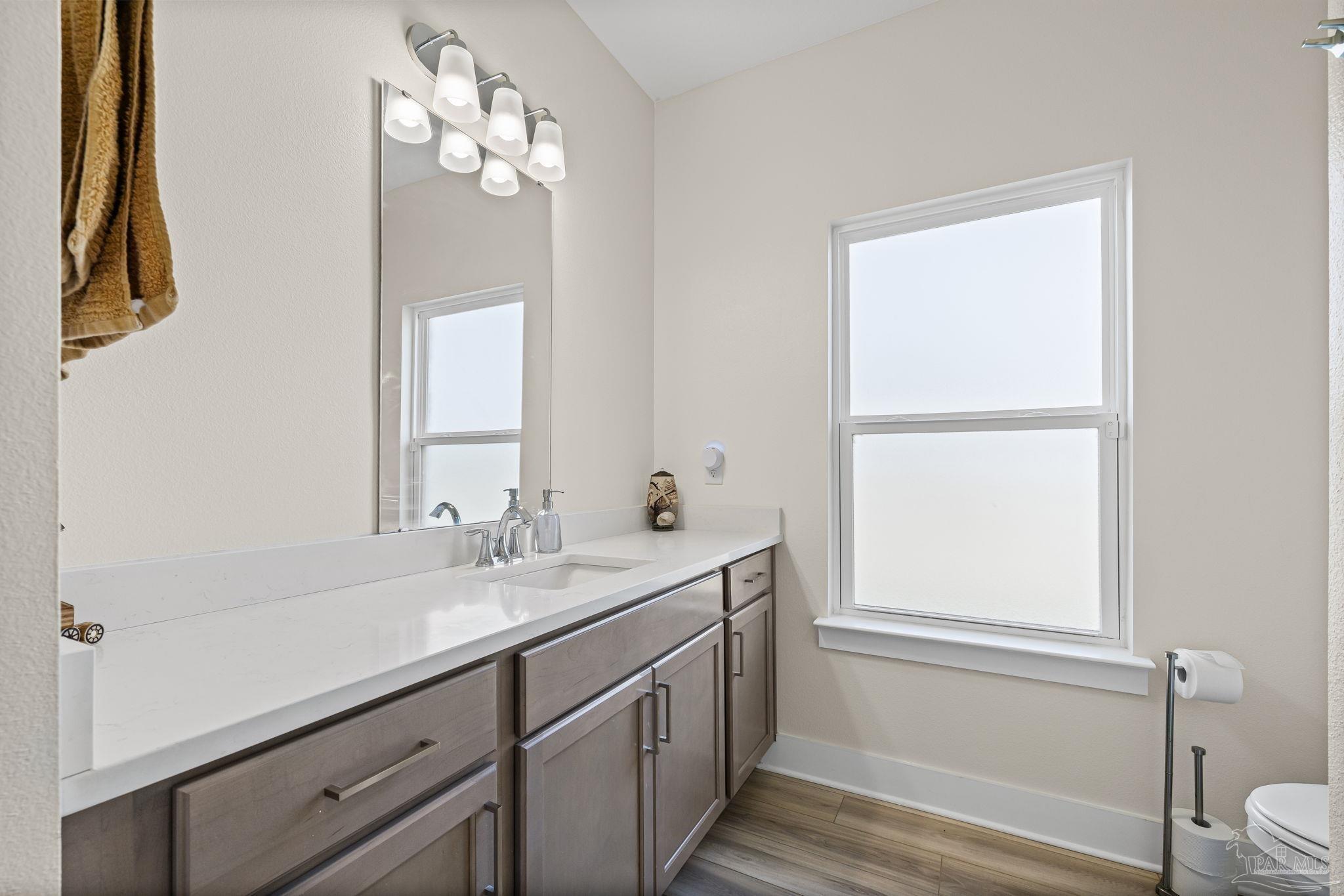 6266 Dry Creek Road Molino, FL 32577 - Photo 32 of 68 a bathroom with a double vanity sink and a mirror