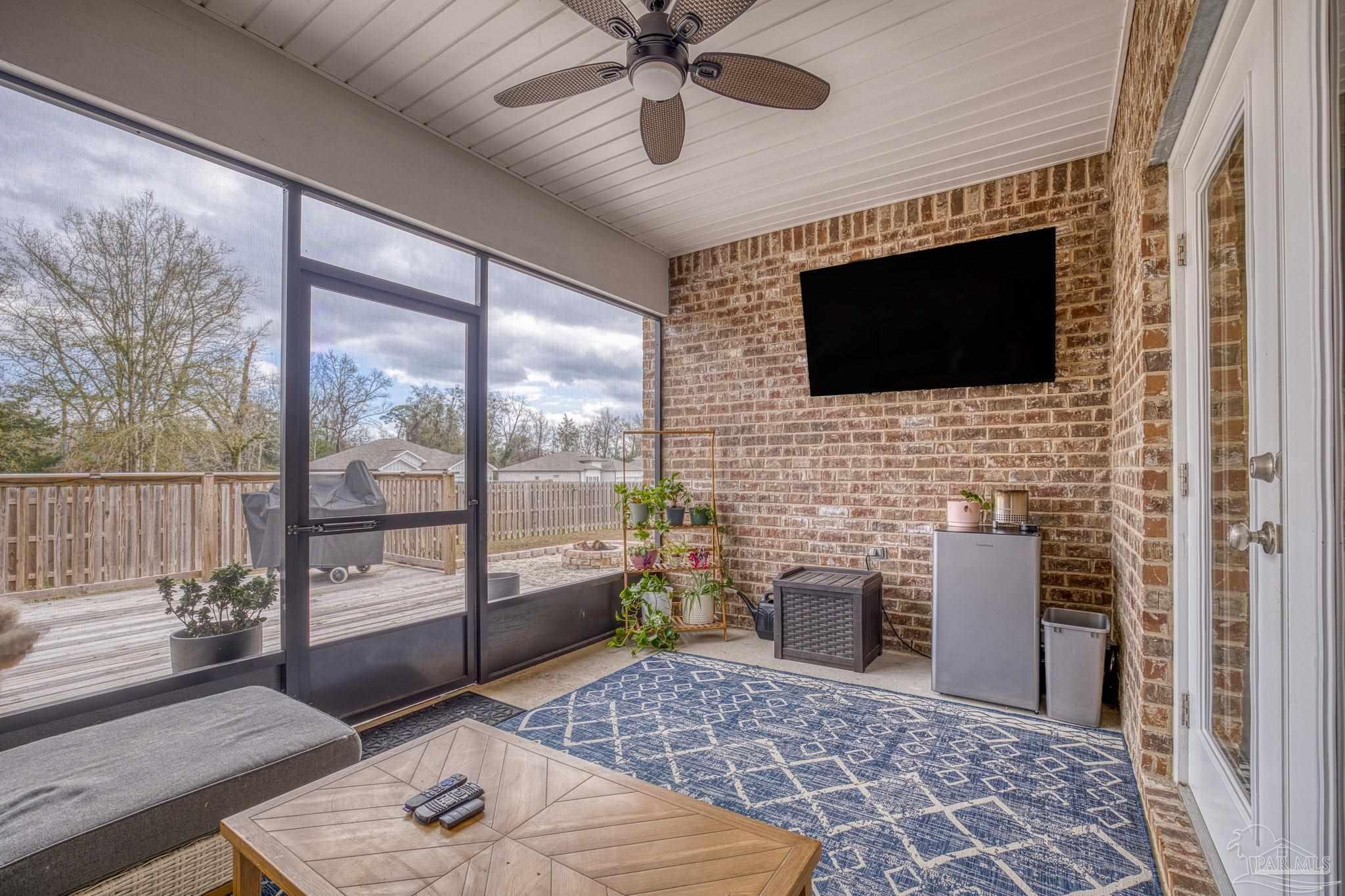 6266 Dry Creek Road Molino, FL 32577 - Photo 41 of 68 a living room with a flat screen tv and a fireplace