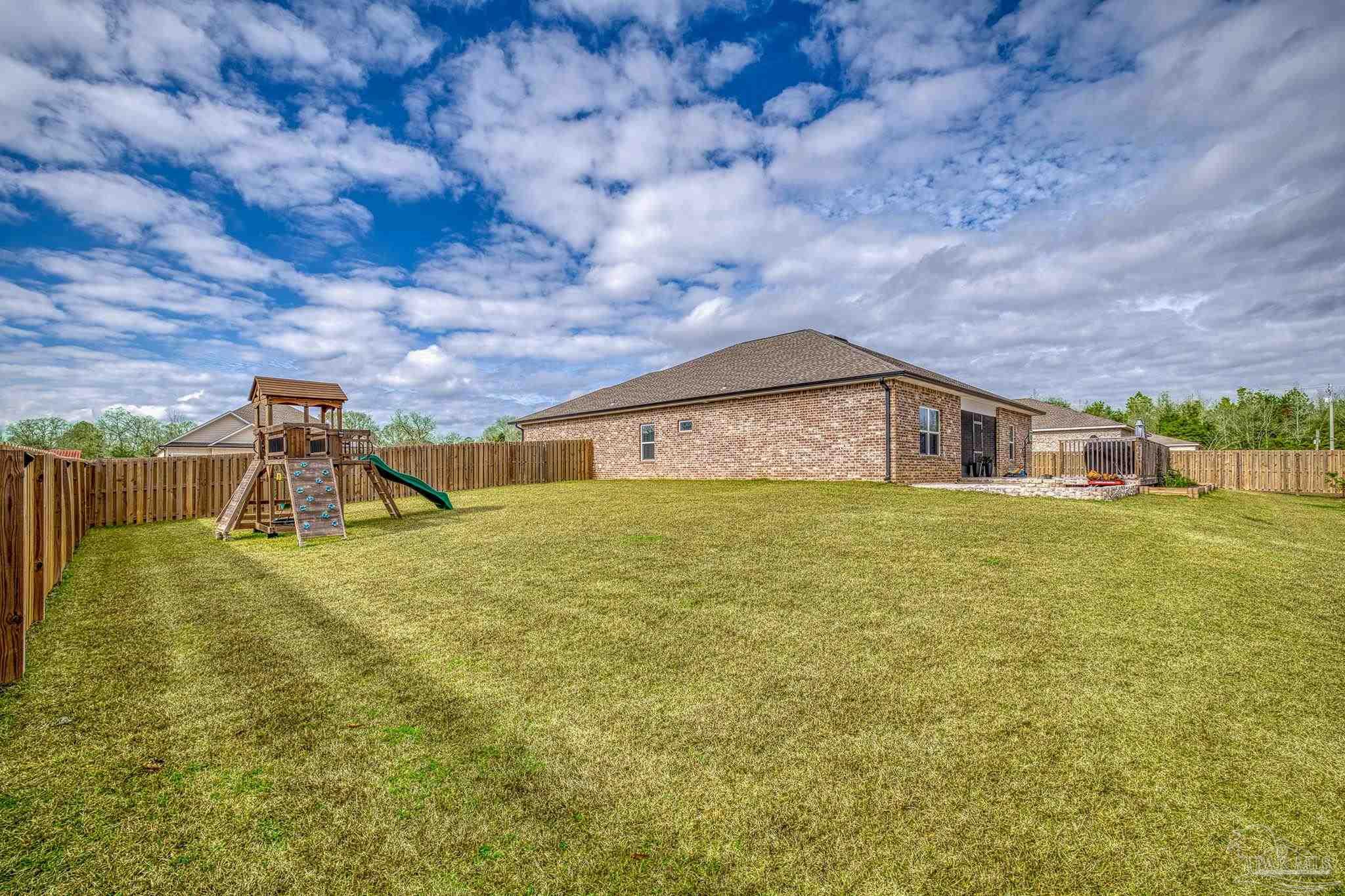 6266 Dry Creek Road Molino, FL 32577 - Photo 56 of 68 a house view with swimming pool in front of it
