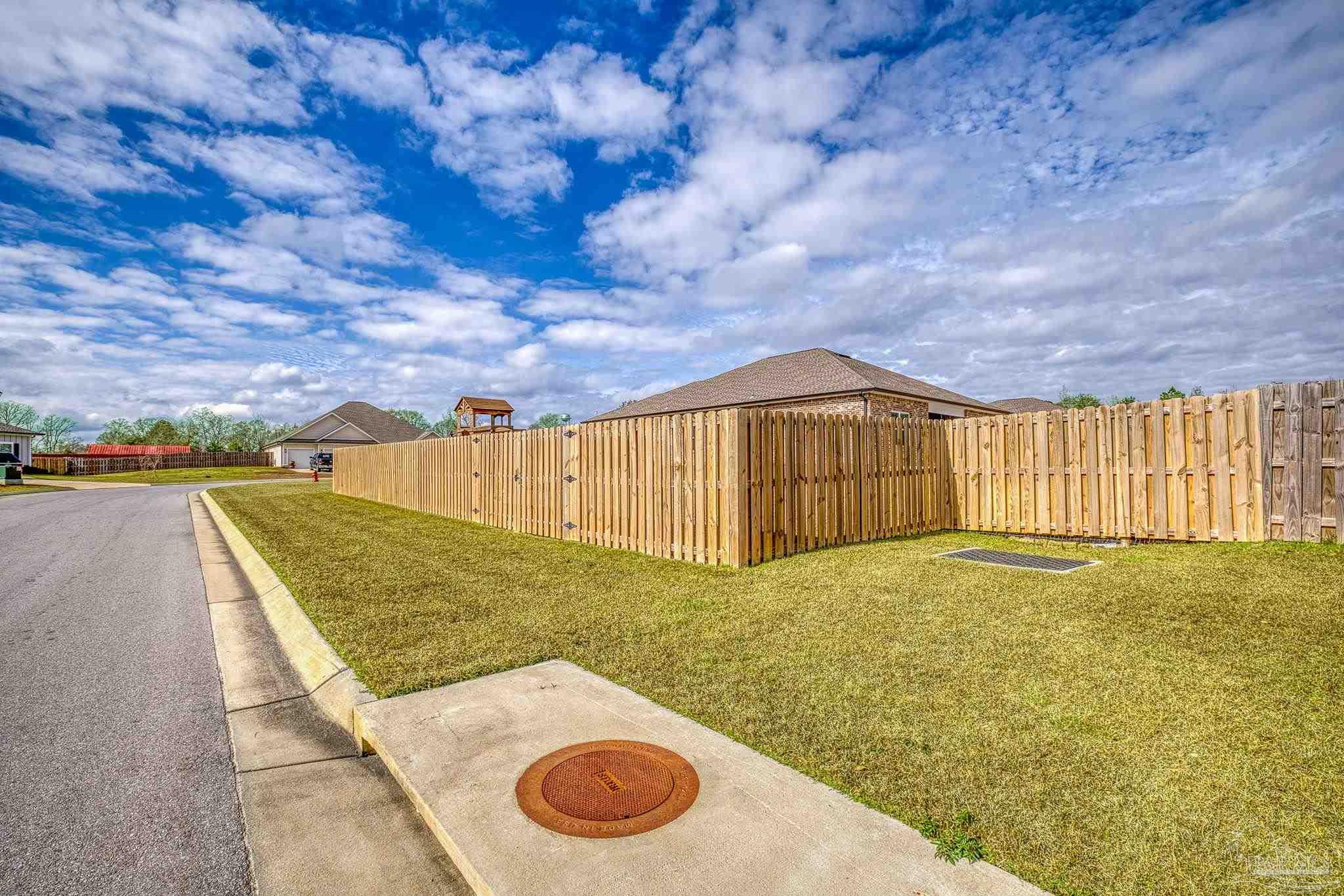6266 Dry Creek Road Molino, FL 32577 - Photo 60 of 68 a view of an outdoor space and swimming pool